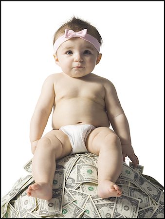 simsearch:640-02773909,k - Baby girl sitting on pile of US currency Stock Photo - Premium Royalty-Free, Code: 640-02772269