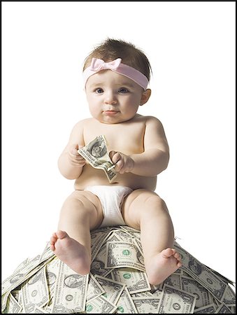 simsearch:640-02773908,k - Baby girl sitting on pile of US currency Stock Photo - Premium Royalty-Free, Code: 640-02772263