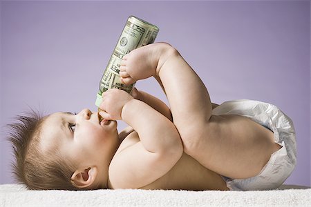 simsearch:640-01352199,k - Baby drinking from bottle with US currency in it Fotografie stock - Premium Royalty-Free, Codice: 640-02772324