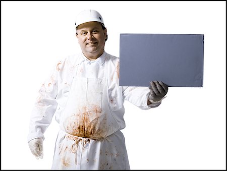 simsearch:640-02772428,k - Butcher standing with blank sign Foto de stock - Sin royalties Premium, Código: 640-02772423