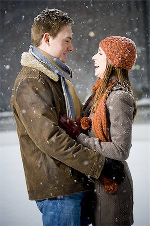 simsearch:640-02772458,k - Couple embracing outdoors in winter Stock Photo - Premium Royalty-Free, Code: 640-02772459
