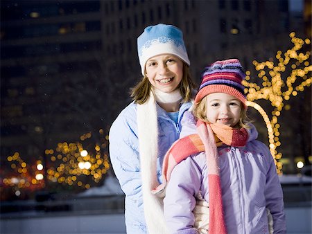 simsearch:640-01601334,k - Two girls outdoors in winter smiling Stock Photo - Premium Royalty-Free, Code: 640-02772482