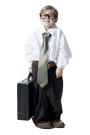 Little boy dressed as business executive Stock Photo - Premium Royalty-Free, Code: 640-02772515