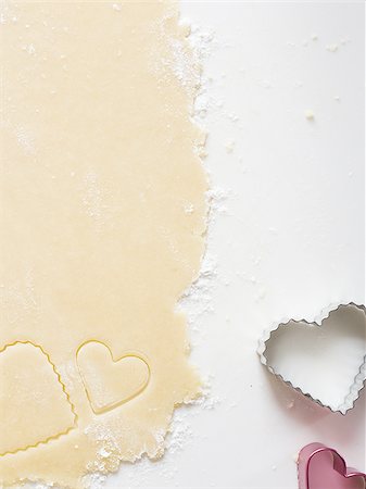 simsearch:640-02772561,k - Detailed view of dough with heart cookie cutter Stock Photo - Premium Royalty-Free, Code: 640-02772554