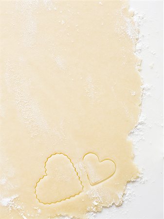 simsearch:640-02772561,k - Detailed view of dough with heart cookie cutter Stock Photo - Premium Royalty-Free, Code: 640-02772555