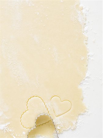 simsearch:640-02772561,k - Detailed view of dough with heart cookie cutter Stock Photo - Premium Royalty-Free, Code: 640-02772556