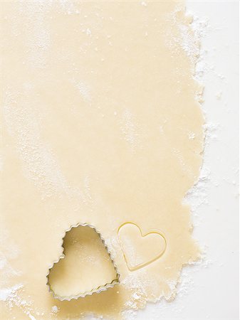 simsearch:640-02772561,k - Detailed view of dough with heart cookie cutter Stock Photo - Premium Royalty-Free, Code: 640-02772557
