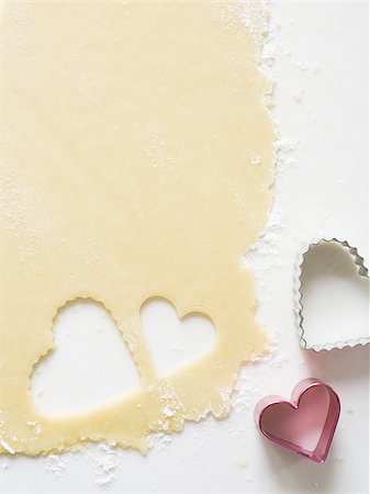 simsearch:640-02772561,k - Detailed view of dough with heart cookie cutter Stock Photo - Premium Royalty-Free, Code: 640-02772558