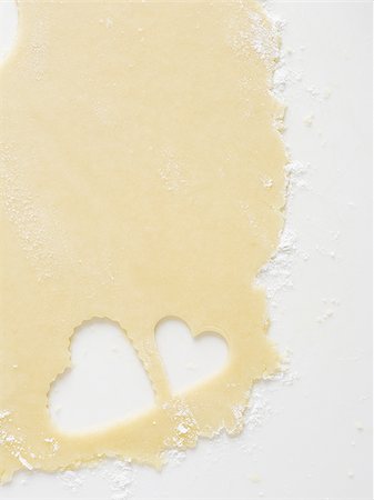 simsearch:640-02772561,k - Detailed view of dough with heart cookie cutter Stock Photo - Premium Royalty-Free, Code: 640-02772559