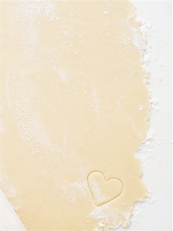 simsearch:640-02772561,k - Detailed view of dough with hearts and rolling pin Stock Photo - Premium Royalty-Free, Code: 640-02772560