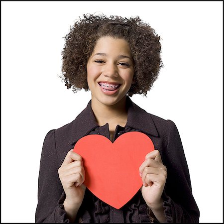 Girl with red heart Stock Photo - Premium Royalty-Free, Code: 640-02772636