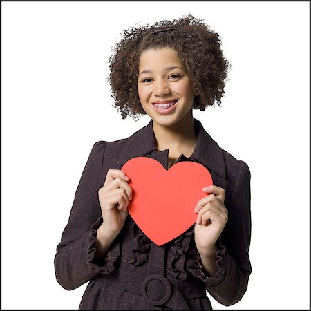 Girl with red heart Stock Photo - Premium Royalty-Free, Code: 640-02772633