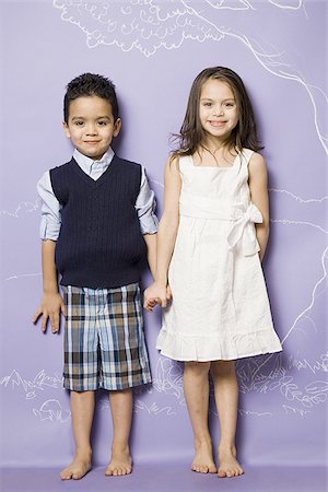 simsearch:640-02772715,k - Young girl and boy holding hands smiling Stock Photo - Premium Royalty-Free, Code: 640-02772714