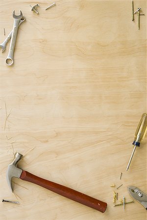 Tools and fasteners on hardwood floor Stock Photo - Premium Royalty-Free, Code: 640-02773022