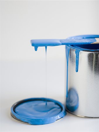 dripping paint - Dripping paint can with stir stick Stock Photo - Premium Royalty-Free, Code: 640-02773073