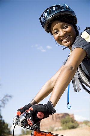 simsearch:640-01353835,k - Female cyclist with helmet outdoors smiling Stock Photo - Premium Royalty-Free, Code: 640-02773179