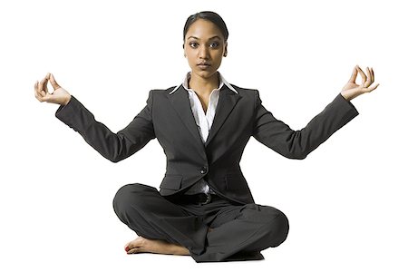 simsearch:640-03261348,k - Femme d'affaires assis les jambes faisant du yoga Photographie de stock - Premium Libres de Droits, Code: 640-02773264