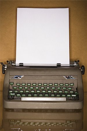 Old typewriter with blank page Stock Photo - Premium Royalty-Free, Code: 640-02773285