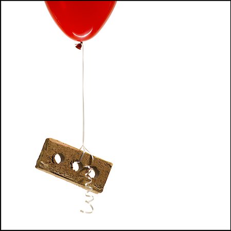 elio - Helium balloon lifting brick Fotografie stock - Premium Royalty-Free, Codice: 640-02773713