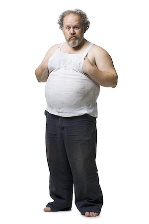 fat belly white background - Disheveled man with hands on pot belly Stock Photo - Premium Royalty-Free, Code: 640-02773755