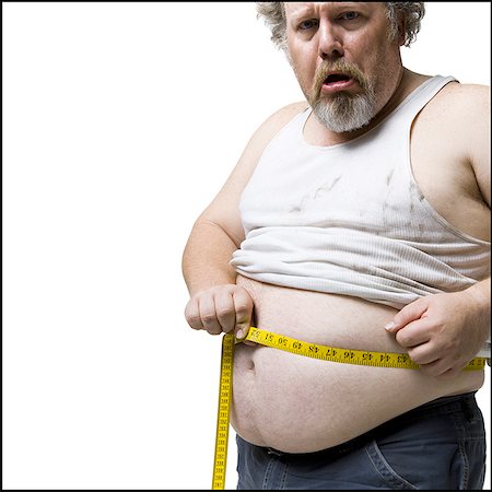 Homme obèse taille avec toise de mesure Photographie de stock - Premium Libres de Droits, Code: 640-02773761