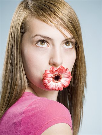 simsearch:640-02770772,k - Close-up of woman with flower in her mouth Stock Photo - Premium Royalty-Free, Code: 640-02773808