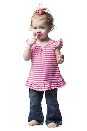 photo of girl with beauty product - Young girl with lipstick on face Foto de stock - Sin royalties Premium, Código: 640-02773911