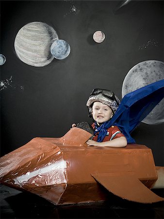 pictures of space rockets - little boy in a rocketship Stock Photo - Premium Royalty-Free, Code: 640-02947534