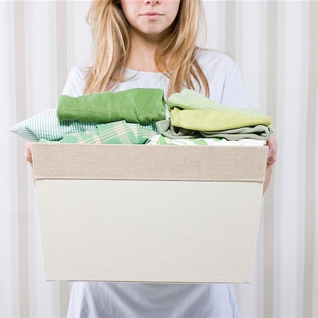 simsearch:640-08089311,k - woman with a basket of folded clothes Stock Photo - Premium Royalty-Free, Code: 640-02947604