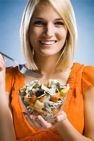 woman eating a salad made of money Stock Photo - Premium Royalty-Free, Code: 640-02947863