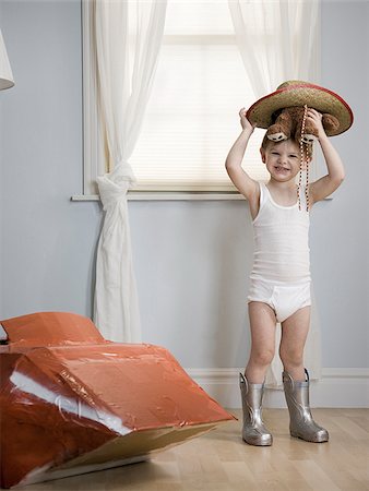 ropa interior - little boy in his room with a red rocketship Foto de stock - Sin royalties Premium, Código: 640-02947889