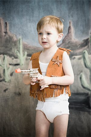 ropa interior - little boy pretending to be cowboy Foto de stock - Sin royalties Premium, Código: 640-02947898