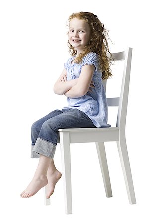 girl sitting in a chair Stock Photo - Premium Royalty-Free, Code: 640-02948015