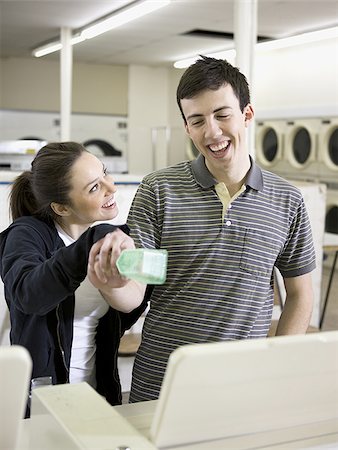 man and woman at a laundromat Stock Photo - Premium Royalty-Free, Code: 640-02948177