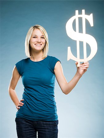 woman holding up a dollar symbol Foto de stock - Sin royalties Premium, Código: 640-02948204