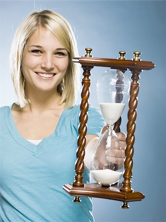 woman holding an hourglass Stock Photo - Premium Royalty-Free, Code: 640-02948267