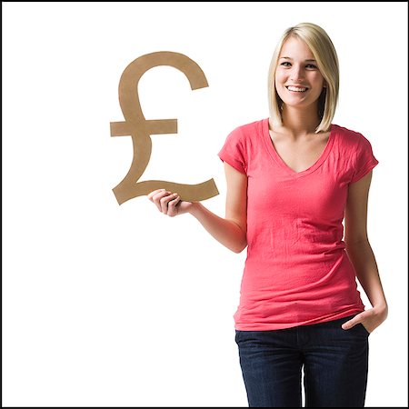 pound - woman holding up british pound symbol Foto de stock - Sin royalties Premium, Código: 640-02948290