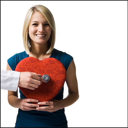doctor heart - woman holding an oversized red heart Stock Photo - Premium Royalty-Free, Code: 640-02948341