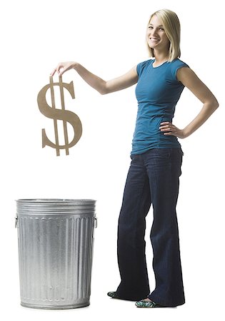 simsearch:640-02948353,k - woman throwing dollar symbol in the trash Foto de stock - Royalty Free Premium, Número: 640-02948355