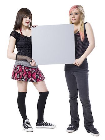 simsearch:640-02948401,k - two rocker girls holding a sign Stock Photo - Premium Royalty-Free, Code: 640-02948406