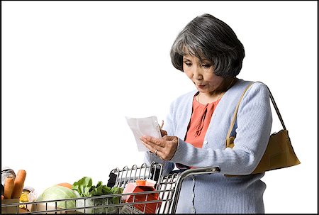 simsearch:640-06051924,k - woman looking at a shopping list Stock Photo - Premium Royalty-Free, Code: 640-02948409