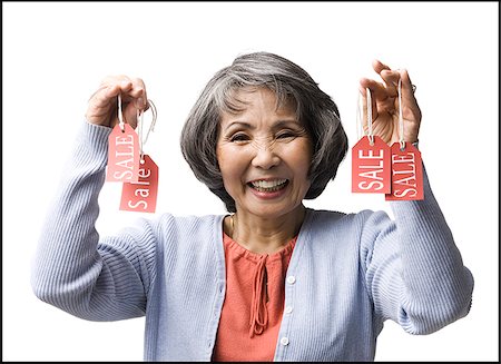 woman holding "sale" tags Stock Photo - Premium Royalty-Free, Code: 640-02948442