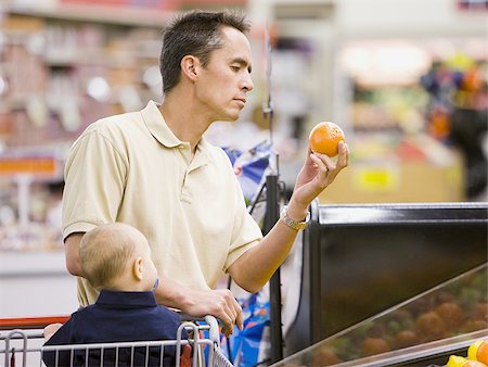 shopping cart not food - man grocery shopping with baby Stock Photo - Premium Royalty-Free, Code: 640-02948589