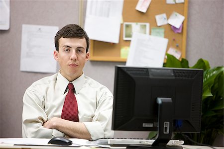 man in a cubicle Stock Photo - Premium Royalty-Free, Code: 640-02948811
