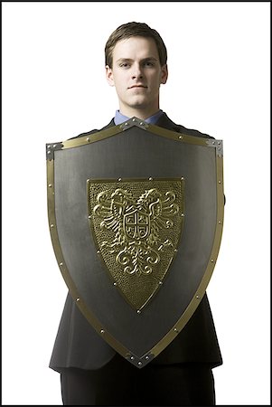 businessman holding a shield Stock Photo - Premium Royalty-Free, Code: 640-02948891