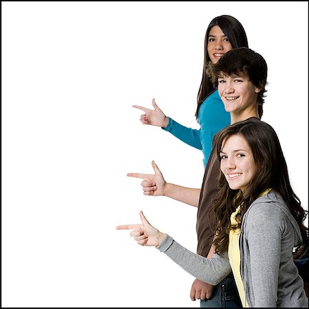 three teenagers pointing Stock Photo - Premium Royalty-Free, Code: 640-02949055