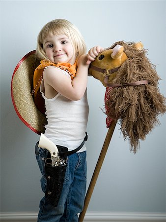 petite fille à s'habiller comme une cow-girl Photographie de stock - Premium Libres de Droits, Code: 640-02949173