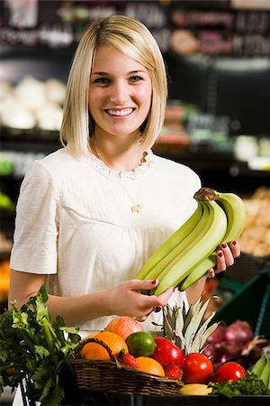 single banana - woman buying produce at the supermarket Stock Photo - Premium Royalty-Free, Code: 640-02949199