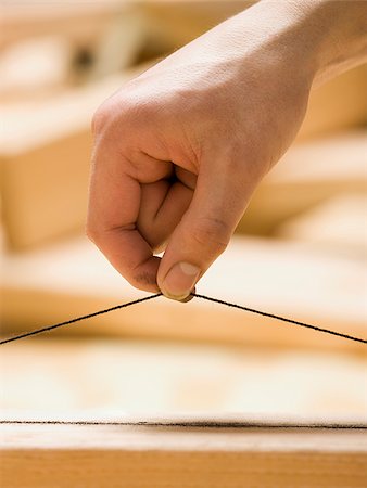 simsearch:640-02949477,k - hand holding a plumb line Stock Photo - Premium Royalty-Free, Code: 640-02949477