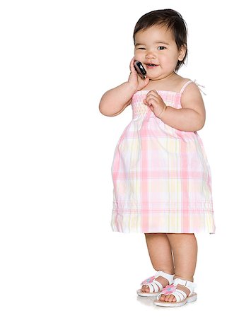 simsearch:640-02949618,k - baby girl in a pink dress holding a cell phone Stock Photo - Premium Royalty-Free, Code: 640-02949614